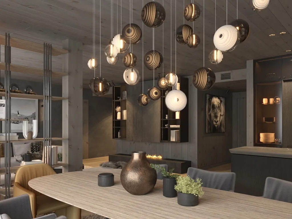 Apartment B13–14, Kvitfjell, Norway: dining table beneath sculptural pendant lights
