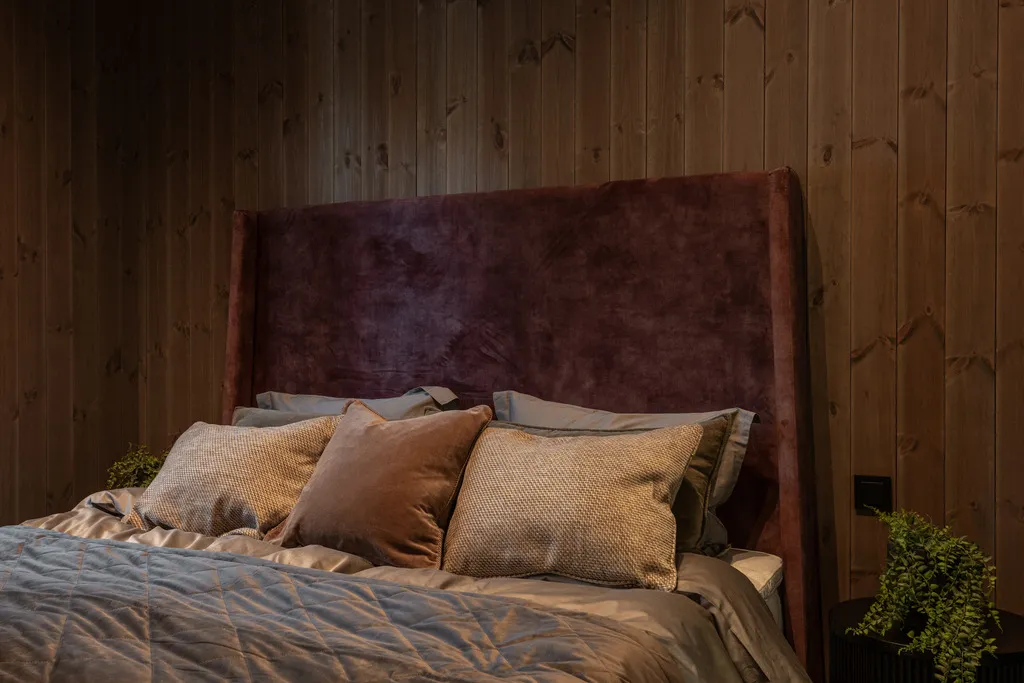 Apartment B22, Kvitfjell, Norway: double bedroom with an upholstered headboard